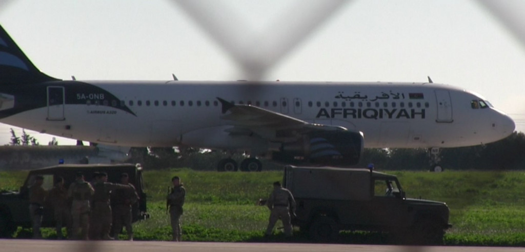Hijacked Libyan plane lands in Malta; hijacker claiming to be in possession of a hand grenade